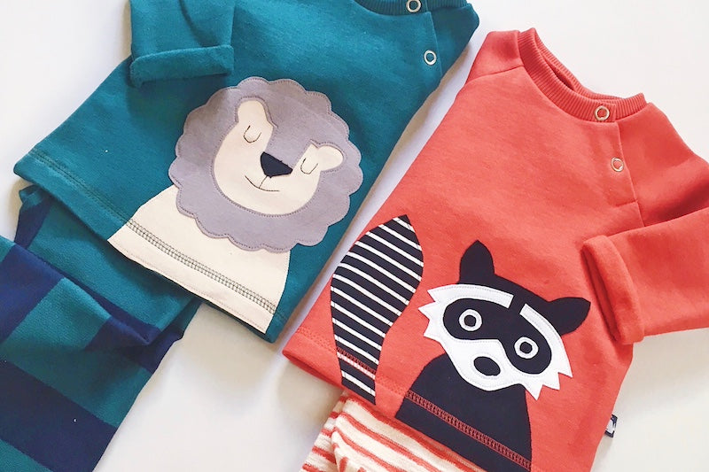 Baby Pullover aus Bio Baumwolle mit Löwe und Waschbär von internaht aus Dresden