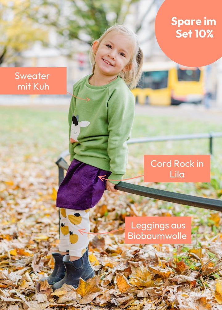 Kinder-Outfit mit Kuh-Sweater, Cord Rock in Lila und Leggings mit Äpfeln Gelb aus Biobaumwolle von internaht